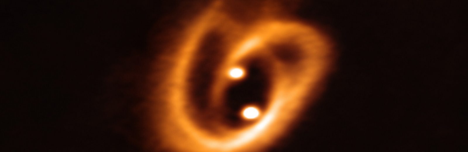 One cosmic pretzel for two baby stars